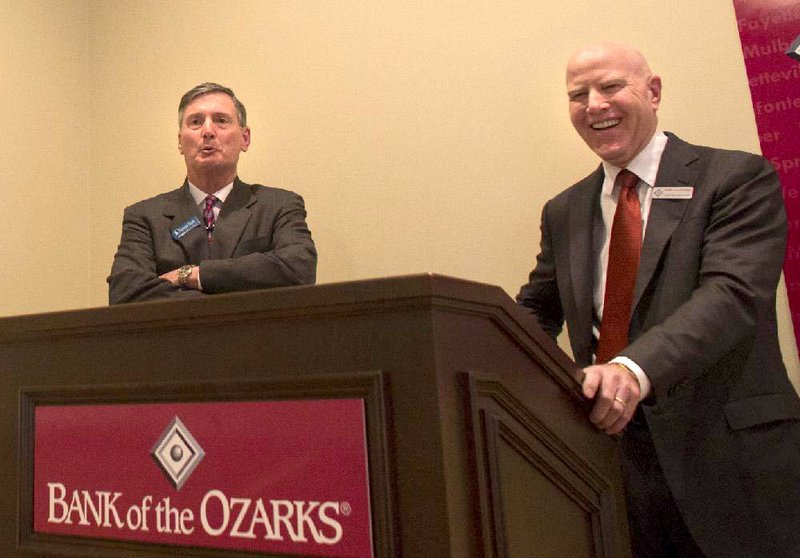 George Gleason, (right), CEO of Bank of the Ozarks, and Ross Whipple, CEO of Summit Bancorp held a news conference Thursday at the Capital Hotel in Little Rock to announce Bank of the Ozarks’ purchase of Arkadelphia-based Summit Bancorp. 