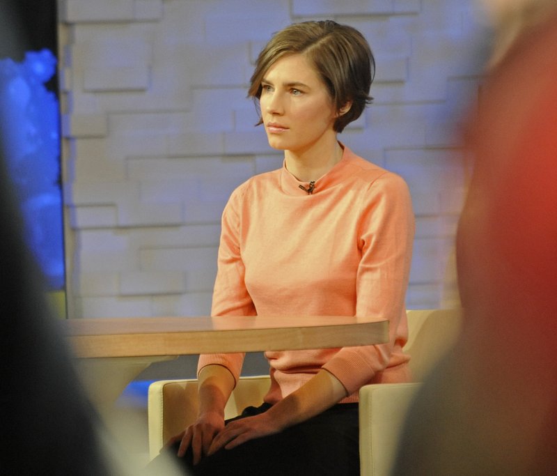 Amanda Knox waits on a television set for an interview, Friday, Jan. 31, 2014 in New York. Knox said she will fight the reinstated guilty verdict against her and an ex-boyfriend in the 2007 slaying of a British roommate in Italy and vowed to "never go willingly" to face her fate in that country's judicial system . "I'm going to fight this to the very end," she said in an interview with Robin Roberts on ABC's "Good Morning America." (AP Photo/ Louis Lanzano)