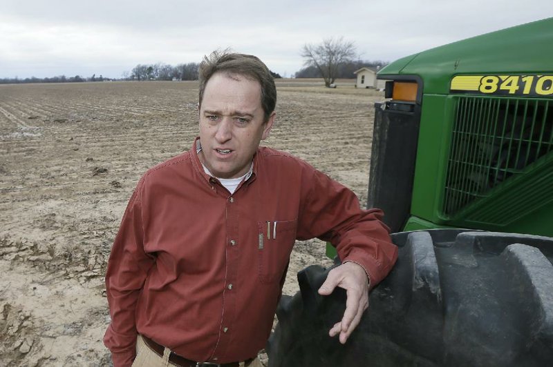 Dow Brantley discusses his plans for the coming growing season at one of his fields Friday near England, Ark. 