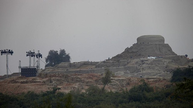 Spotlights are installed at the ruins of Mohenjodaro, listed on UNESCO's list of world heritage sites, in preparation of a grand cultural festival, near Larkana, some 400 kilometers (248 miles) north of the Pakistani port city of Karachi, Pakistan, Saturday, Feb. 1, 2014. The event at Mohenjodaro, whose unbaked brick ruins date to the 3rd millennium BC, has however drawn criticism from some archaeologists who say it poses a risk to the monuments. Bilawal Bhutto Zardari, the son of assassinated Pakistani Prime Minister Benazir Bhutto, organized the Festival aimed at promoting peace in this Islamic nation, where militant violence has killed over 40,000 people in recent years, organizers said. (AP Photo/Shakil Adil)