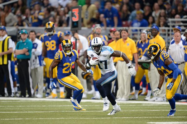 Damian Williams splits two defenders after catching a pass during a game last season against St. Louis Rams. Williams is an impending free agent after playing the previous four years with the Tennessee Titans.