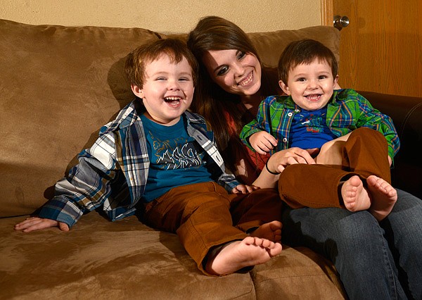 Brittany Erter with her two sons, Eli, left, 2, and Bentlee, 1, Thursday, Jan. 16, 2014 at her home in Siloam Springs. The boys are in the National Children's Study will monitor the boys from birth to age 21 and observe any link between health and environment.
