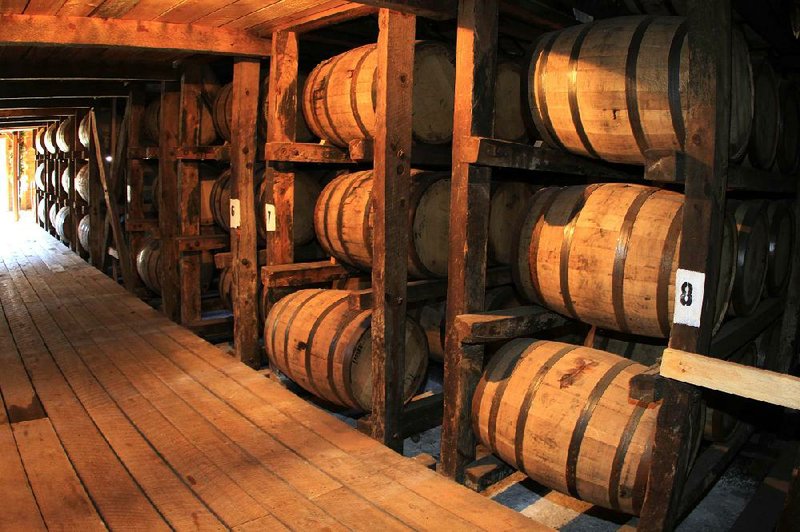 Whiskey ages in oak barrels inside a Maker’s Mark Distillery Inc. rack house in Loretto, Ky. Bourbon and Tennessee whiskey exports grew a projected 5 percent to surpass $1 billion for the fi rst time last year, the Distilled Spirits Council said Tuesday. 