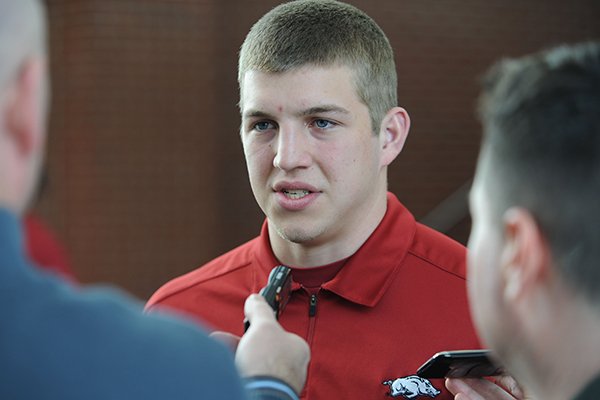 Rafe Peavey, a quarterback from Bolivar, Mo., answers questions during a National Signing Day ceremony Wednesday, Feb. 5, 2014, at the university's football complex.