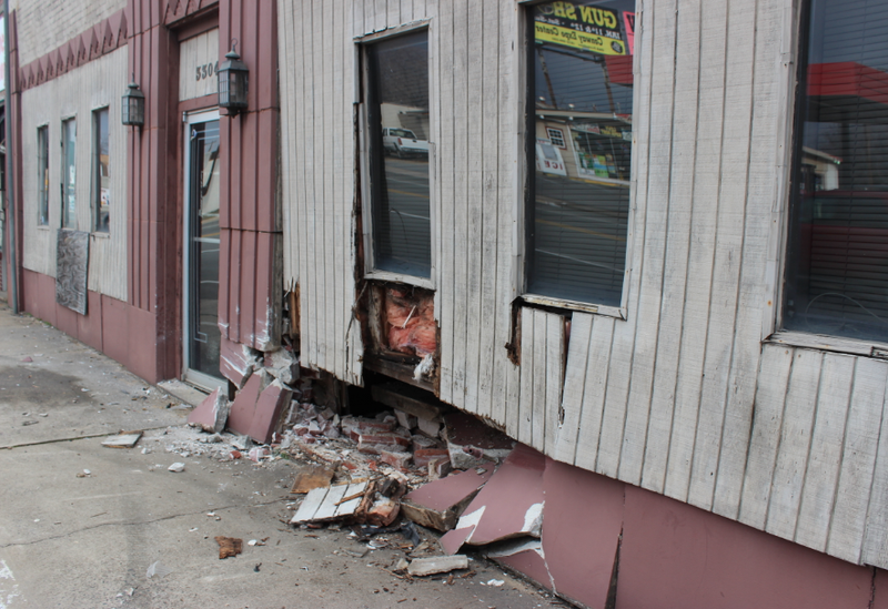 A building in the 3300 block of Pike Avenue suffered extensive damage when a fleeing vehicle hit it late Tuesday night, authorities said.