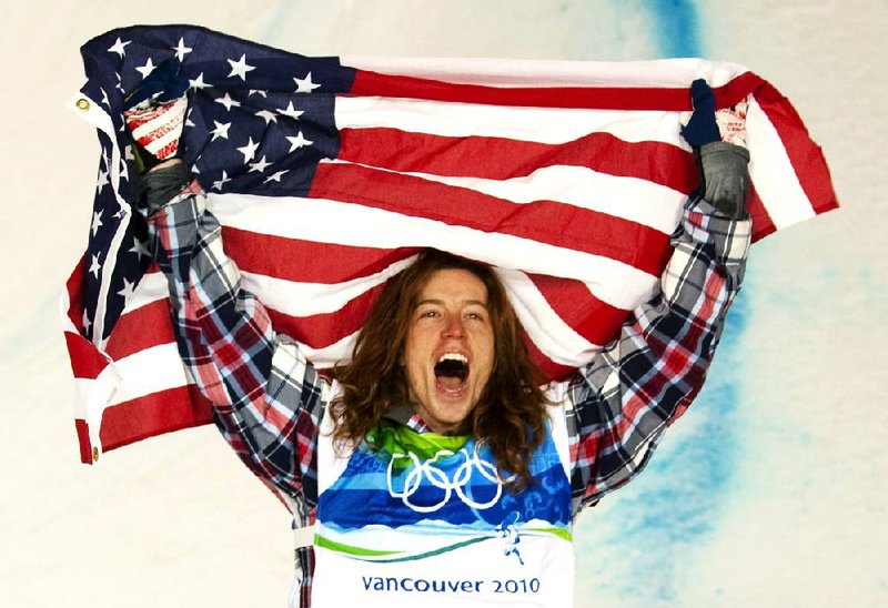 FILE - In this Feb. 17, 2010, file photo, Shaun White of the United States celebrates his gold medal in the men's snowboard halfpipe at Cypress Mountain in West Vancouver, Brtish Columbia, at the 2010 Vancouver Olympic Winter Games. White said Wednesday, Feb. 5, that he is pulling out of the Olympic slopestyle contest to focus solely on winning a third straight gold medal on the halfpipe. (AP Photo/The Canadian Press, Sean Kilpatrick, File)