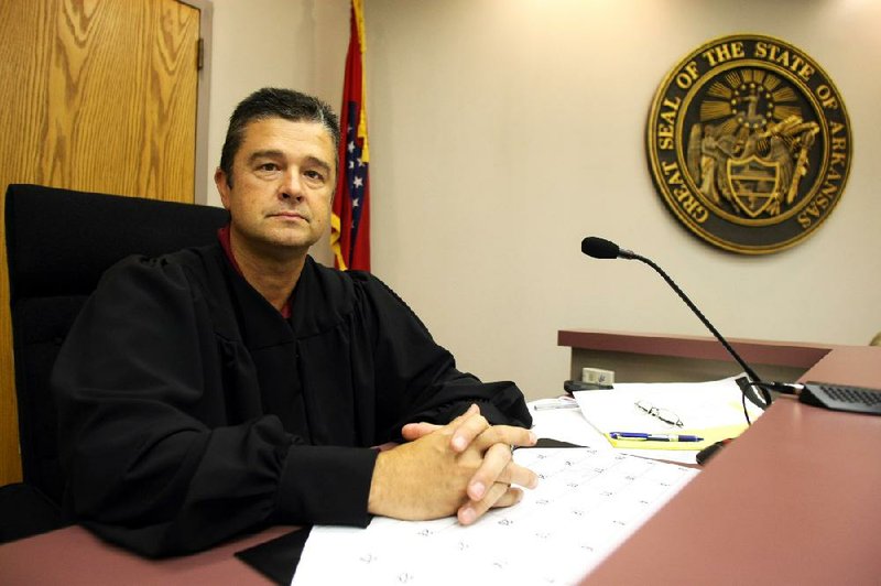 FILE — Saline County Circuit Judge Bobby McCallister between cases in juvenile court at the Saline County Courthouse in 2009.