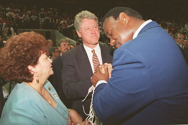 Arkansas coach Nolan Richardson (right) spends an emotional moment with his wife Rose and President Bill Clinton after an NCAA championship victory on Monday, April 4, 1994 in Charlotte, N.C.