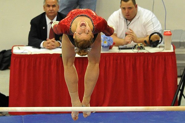 Arkansas gymnast Erin Freier performs on the bars during a Jan. 10, 2014 gymnastics meet at Barnhill Arena in Fayetteville.