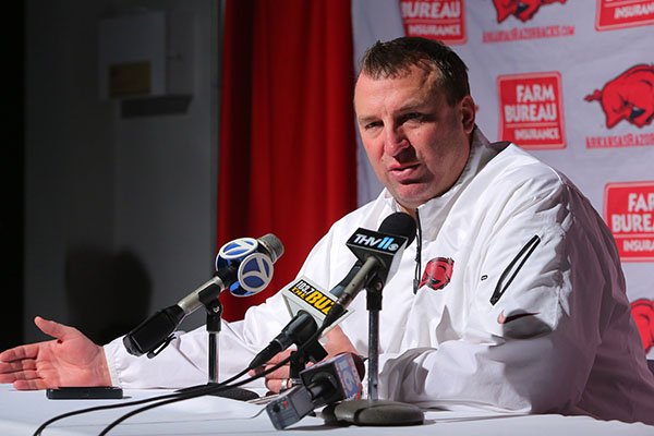 Arkansas football coach Bret Bielema talks with the media before a private Signing Day in the Rock event Thursday evening in Little Rock.