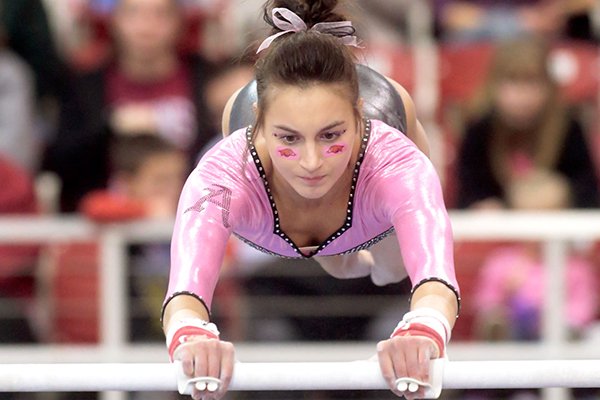 Arkansas junior Stephani Canizaro competes on the beam on Friday, Feb. 7, 2014, during a meet against Louisiana State at Barnhill Arena in Fayetteville. Canizaro scored a 9.825 in the event.