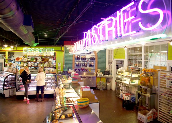 Only a couple of customers browse the items at Rick's Bakery in Fayetteville Thursday Feb. 6, 2014. Some businesses in the area have been hard hit because of the recent winter weather conditions preventing customers to travel to the bakery.