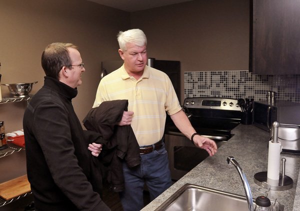 Jim Lay, Executive Director of Facilities and Construction Managemant at Northwest Arkansas Community College, right, explains to NWACC Foundation board member Mike Luttrell how the mock home training area can be easily reconfigured to represent a variety of scenarios during an open house to celebrate the opening of the Melba Shewmaker National Child Protection Training Center at the Northwest Arakansas Community College campus in Bentonville on Thursday February 6, 2014.