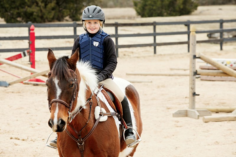 Leah Goff, 9, of Conway takes a riding lesson at Caney Creek Farm. She participates in hunter/jumper events and was named High Point Rider two years in a row, which her trainer called “amazing.” Leah’s mother, April Goff, said Leah always drew pictures of horses and fell in love with riding when she was 6.