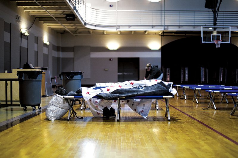 Above: A Red Cross warming center was opened Tuesday in Hot Springs at the First United Methodist Church Family Life Center after freezing rain knocked out power to area residents. The center was accepting anyone who needed a respite from the subfreezing temperatures gripping the state.