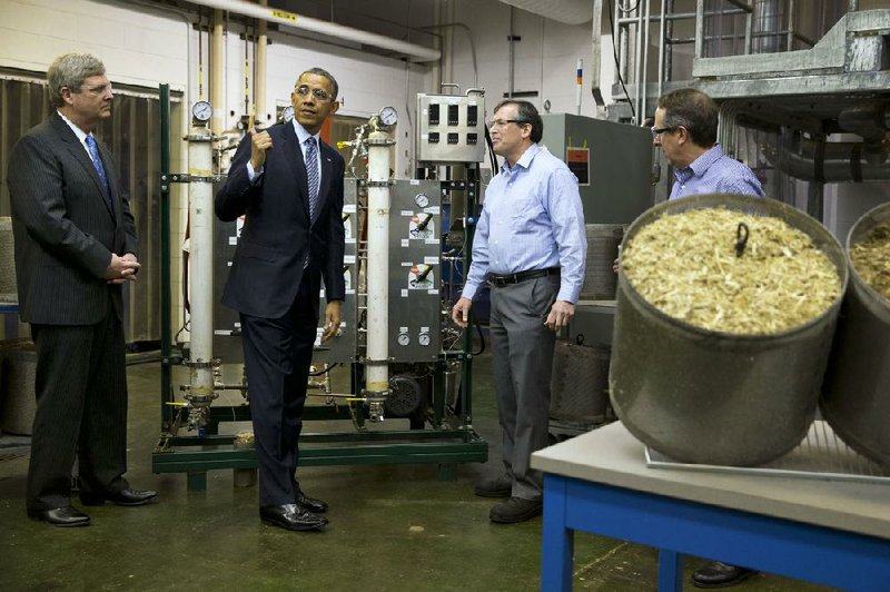 Agriculture Secretary Tom Vilsack (left) and President Barack Obama tour the biomass conversion area at the Michigan Biotechnology Institute in Lansing on Friday. 