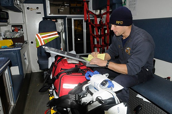 Joshua Kirts, a Rogers firefighter and paramedic student, shows on Tuesday Feb. 4 2014 how ambulances and medical supplies are inspected at the start of each shift.