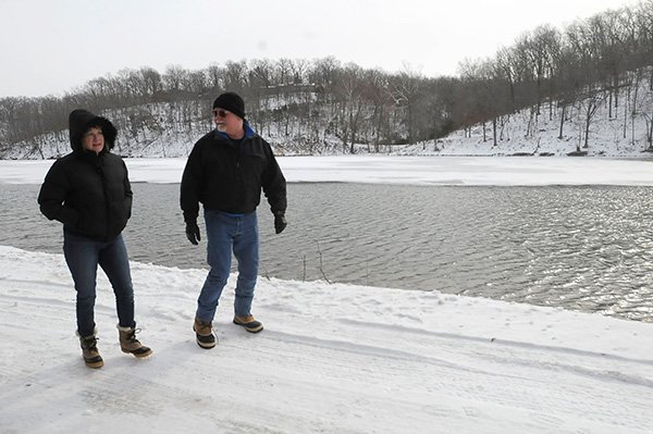 STAFF PHOTO FLIP PUTTHOFF 
Debra and Strad Will stroll Thursday along Lake Atalanta. They live near the lake and frequently walk along the road that circles the lake. The couple favor keeping the road open to vehicles.