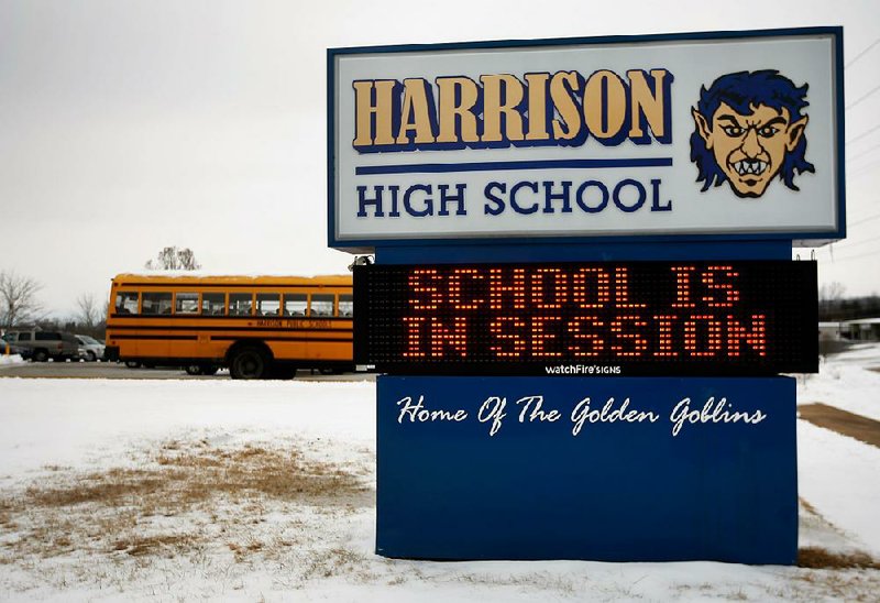 NWA Media/JASON IVESTER --02-08-2014--
With snow and ice still on the ground, the sign out front welcomes students on Saturday, Feb. 8, 2014, at Harrison High School. Students in the district had school on Saturday to make up a day of instruction missed due to winter weather.