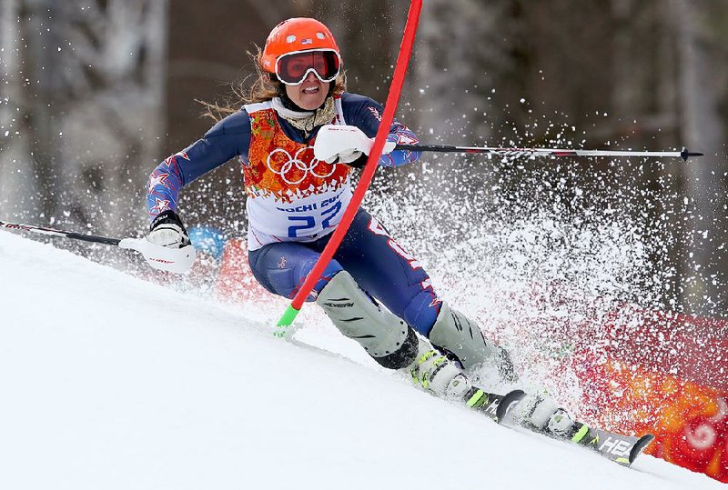 United States' Julia Mancuso skis to win the bronze medal in the women's supercombined at the Sochi 2014 Winter Olympics, Monday, Feb. 10, 2014, in Krasnaya Polyana, Russia. (AP Photo/Alessandro Trovati)