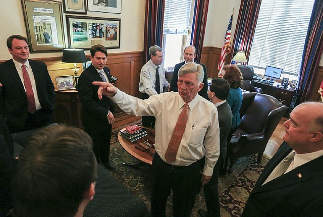Arkansas Democrat-Gazette/RICK MCFARLAND --02/10/14--  Gov. Mike Beebe talks with members of the Arkansas House of Representatives after they informed him that they are now in session at the state Capitol in Little Rock Monday. 