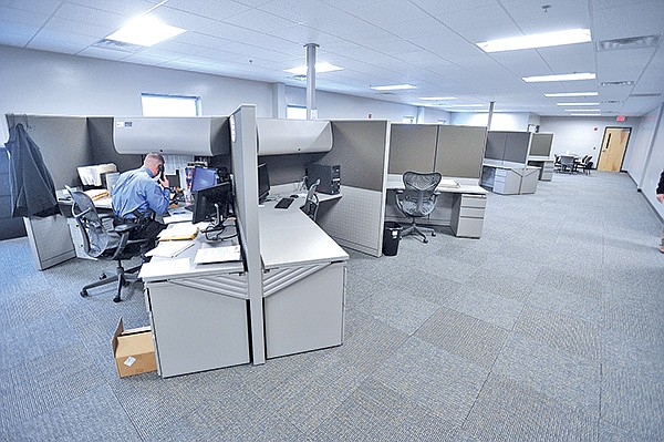 STAFF PHOTO MICHAEL WOODS 
An investigator with the Washington County Sheriff’s Office works at his new desk Monday afternoon in the new office space at the Washington County Sheriffs Office annex.