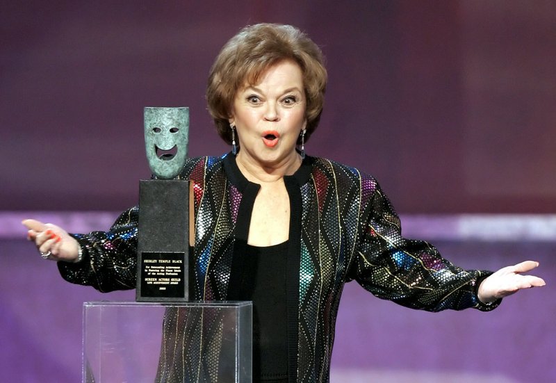  In this Jan. 29, 2006, file photo, Shirley Temple Black accepts the Screen Actors Guild Awards life achievement award at the 12th Annual Screen Actors Guild Awards in Los Angeles. Shirley Temple, the curly-haired child star who put smiles on the faces of Depression-era moviegoers, has died. She was 85. 