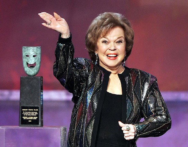 Shirley Temple Black accepts the life-achievement award at the 12th annual Screen Actors Guild Awards in Los Angeles on Jan. 29, 2006. Black died Monday at the age of 85. 