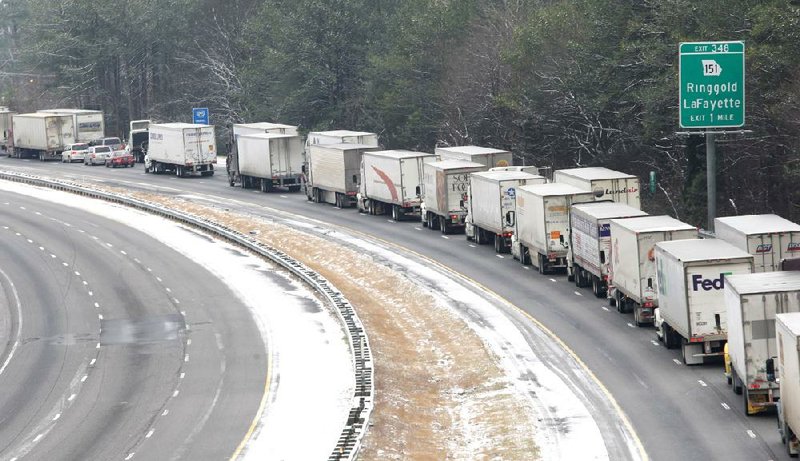 Traffic backs up Tuesday on Interstate 75 South at Ringgold, Ga., as ice builds on the roadway. 