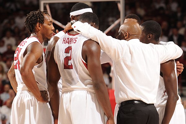 Arkansas coach Mike Anderson speaks to his team during overtime Tuesday, Jan. 14, 2014, in Bud Walton Arena in Fayetteville.