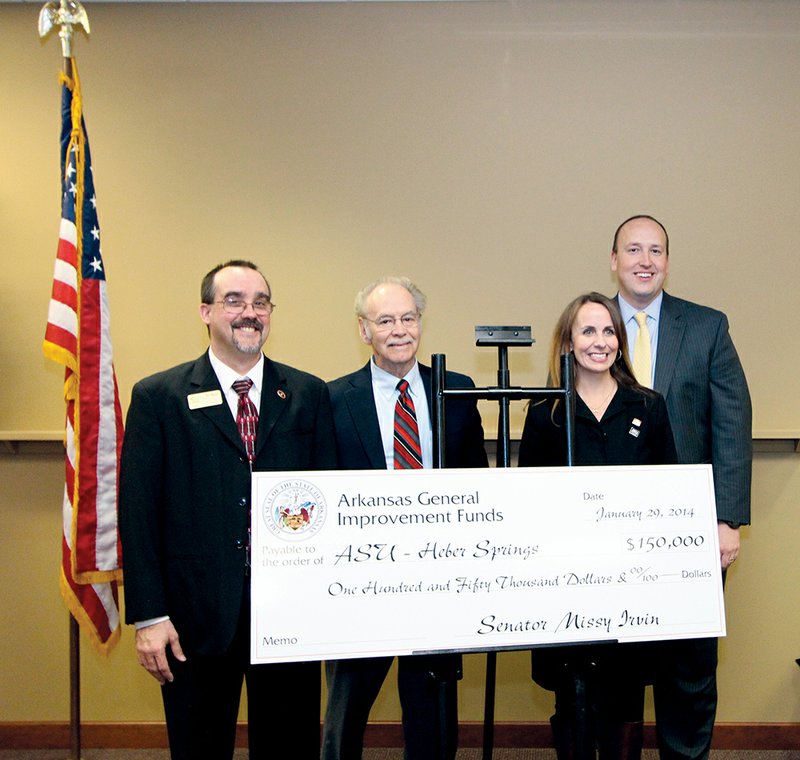 From the left, Chris Boyett, Arkansas State University-Heber Springs vice chancellor; Eugene McKay, ASU-Beebe chancellor; state Sen. Missy Irvin, R-Mountain View; and ASU System President Chuck Welch accept $150,000 of state General Improvement Funds on Jan. 29. The money will be used to purchase a video surveillance system and upgrade computers on the Heber Springs campus.