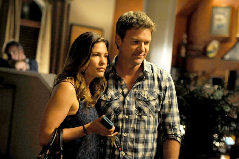 Matt Passmore and Kiele Sanchez starred in A&E’s The Glades, a series abruptly canceled on a cliffhanger. 