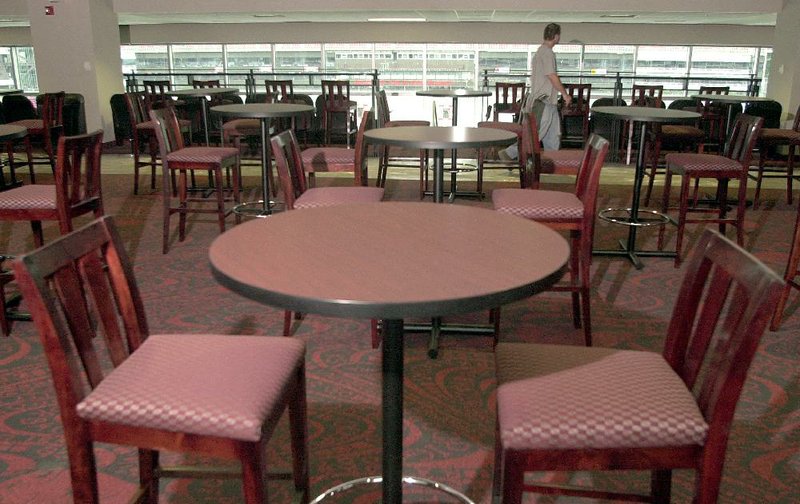 The football field is visible from tables in the club-seating area on the east side of Reynolds Razorback Stadium. Beer and wine will be available to ticket holders in the area when the 2014 season kicks off, University of Arkansas officials said Wednesday. 