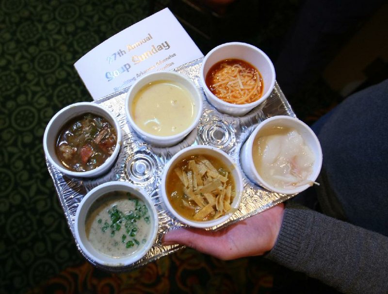 2/17/08
Arkansas Democrat-Gazette/STEPHEN B. THORNTON
A guest carries a selction of soups during the 27th Annual Soup Sunday event at the Embassy Suites hotel in Little Rock.  Guests ate samplings of soup out of muffin trays during the event to benefit the Arkansas Advocates for Children and Families. FOR HIGH PROFILE