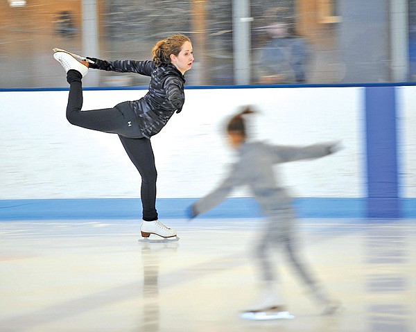 Katie Sabo of Fayetteville practices her routine Thursday as members of  The Ozark Figure Skating Club work out at the Jones Center in Springdale. The Ozark Figure Skating Club, Arkansas Figure Skating Association and Jones Center officials announced Thursday the center will be taking over the figure skating program March 1.