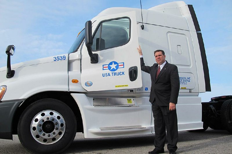 John Simone, chief executive officer at Van Buren-based USA Truck, has had a busy first year working to turn around the trucking company while averting a hostile takeover. 