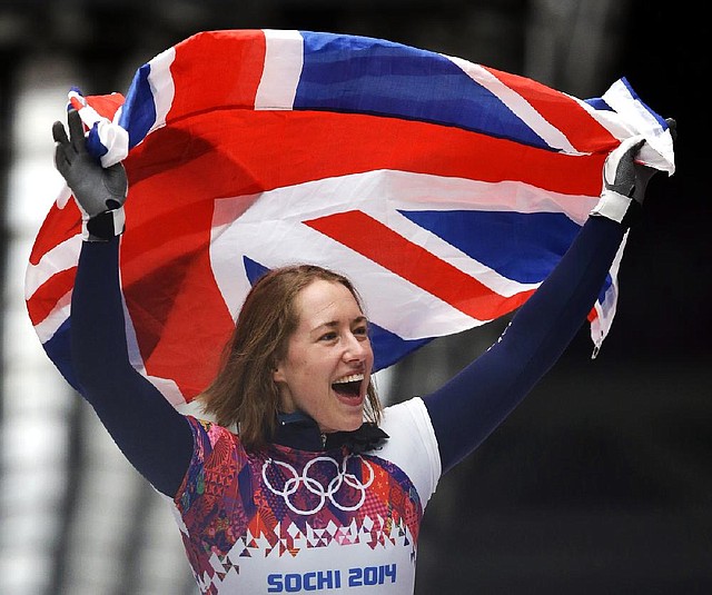Elizabeth Yarnold of Great Britain celebrates her gold medal in women’s skeleton Friday in Krasnaya Polyana, Russia. Yarnold set a track record and won the medal by almost a second over Noelle Pikus-Pace of the United States.