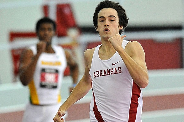 Arkansas runner Neil Braddy sprints to the finish in the first heat of the men's 400 meter dash at the Tyson Invitational track meet at the Randal Tyson Track Complex in Fayetteville.