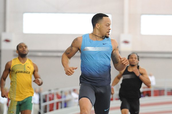 Wallace Spearmon comes in to win the Olympic development 200 meters ahead of fellow former Arkansas standouts, from left, Marek Niit, Akheem Gauntlett, and Lashawn Butler during the Tyson Invitational Saturday, Feb. 15, 2014, at the Randal Tyson Track Center in Fayetteville.