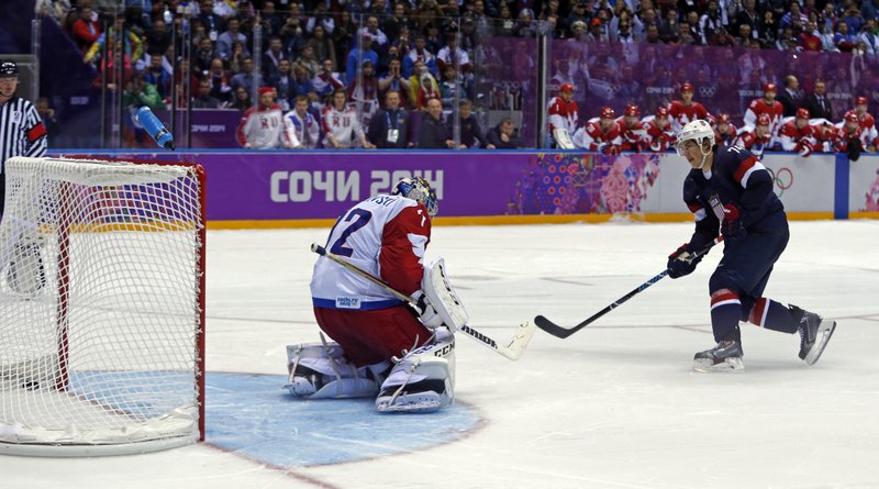 USA forward T.J. Oshie scores the winning goal against Russia goaltender Sergei Bobrovski in a shootout during overtime of a men's ice hockey game at the 2014 Winter Olympics, Saturday in Sochi, Russia.