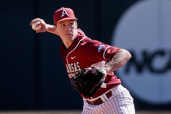 Arkansas second baseman Brian Anderson throws to first during game two of the series against Appalachian State on Saturday, Feb. 15, 2014 at Baum Stadium in Fayetteville. 