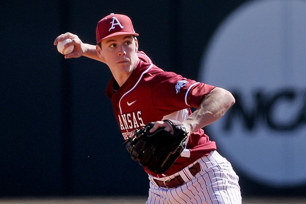 Arkansas second baseman Brian Anderson throws to first during game two of the series against Appalachian State on Saturday, Feb. 15, 2014 at Baum Stadium in Fayetteville. 
