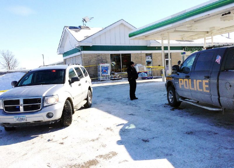 Authorities gather Feb. 7 at the gas station in West Branch, Iowa, where Police Chief Mike Horihan found a newborn boy who had been left outside on a record-setting, minus-11-degree night. 