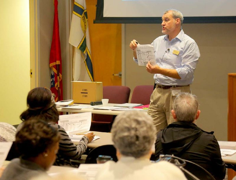 Shawn Camp, assistant director of elections for the Pulaski County Election Commission, discusses how to fill out a voter-assistance form during a poll-worker training session Saturday in Little Rock. 