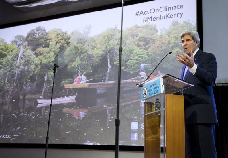 Secretary of State John Kerry gestures during a speech on climate change on Sunday, Feb. 16, 2014, in Jakarta. Kerry called for a "global solution" for climate change in the first of several speeches he will deliver this year on the topic. (AP Photo/ Evan Vucci, Pool)