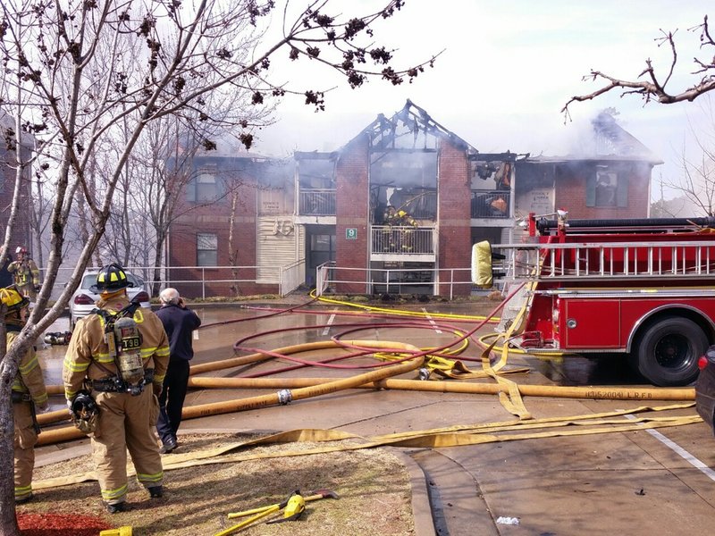 Fire crews battle a blaze at Chapel Ridge Apartments, 24800 Chenal Parkway, in Little Rock on Monday, Feb. 17, 2014.