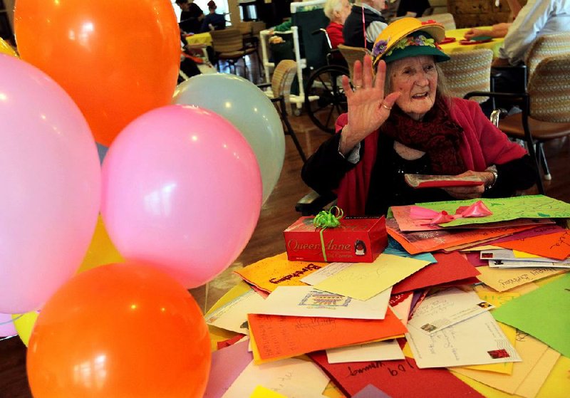 Arkansas Democrat-Gazette/BENJAMIN KRAIN --2/17/2014--
Leta Nolen reads some of the 109 birthday cards she recieved to celebrate her 109th birthday Monday during a party at Robinson Nursing and Rehabilitation Center in North Little Rock.