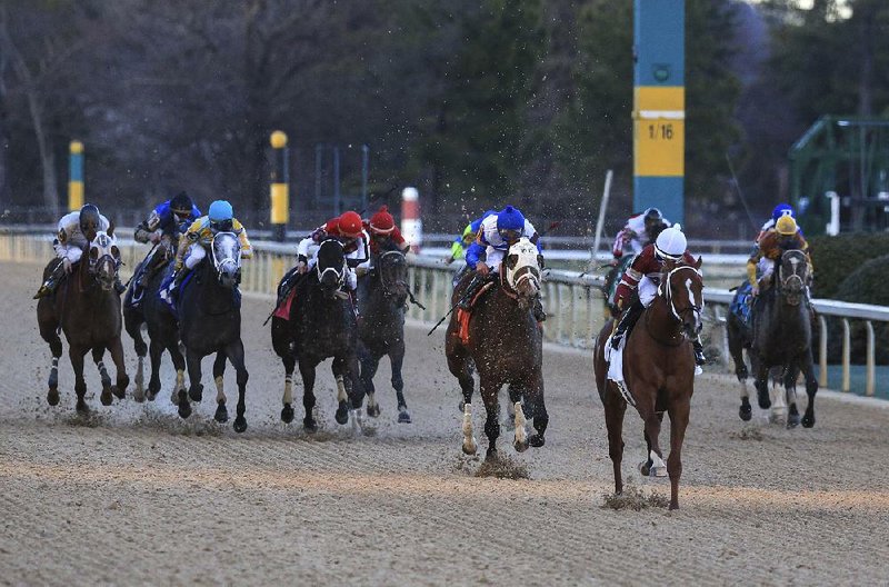 Arkansas Democrat-Gazette/STATON BREIDENTHAL --2/17/14-- Tapiture (#2, second from right)) ridden by Ricardo Santana Jr. leads the field to the finish Monday during the Southwest Stakes at Oaklawn Park in Hot Springs including eventual winner 