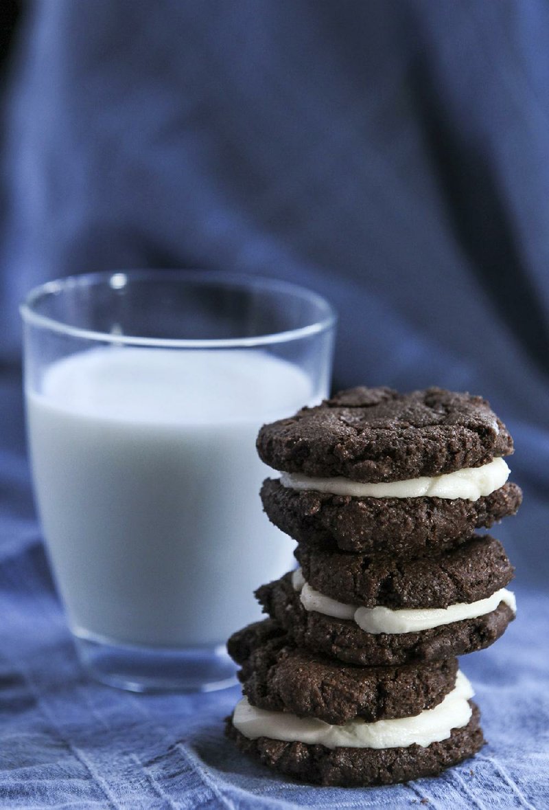Chocolate Sandwich Cookies can be thin and crunchy or puffy and soft, depending on the type of cocoa powder. Natural cocoa will create soft, puffy cookies like these. 