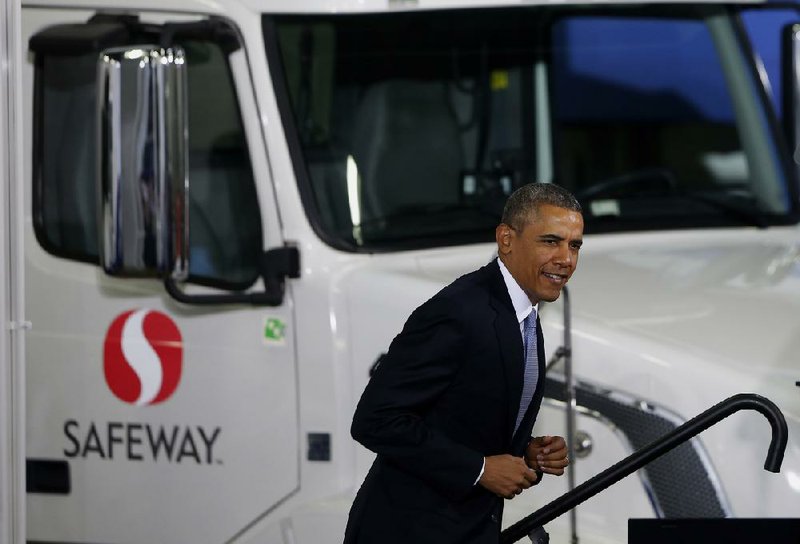 President Barack Obama arrives to speak at a distribution center for Safeway stores in Upper Marlboro, Md., on Tuesday. The president said having a more fuel-efficient truck fleet will boost the economy and help combat climate change. 